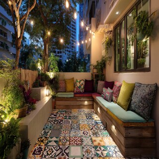 Bohemian Balcony Design With Patterned Tiles and Built-in Seating